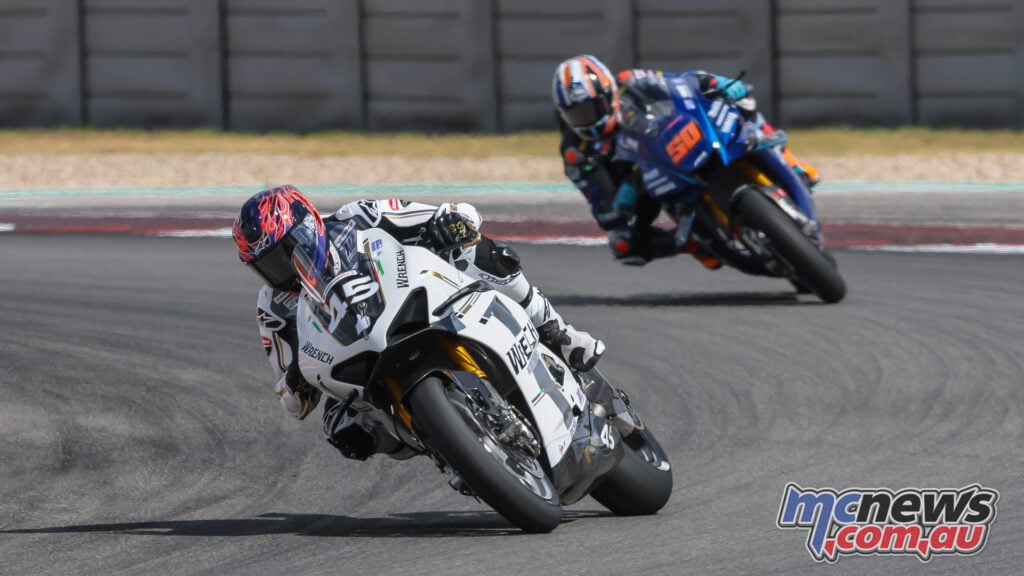 Cameron Petersen’s white number 45 Ducati leads Bobby Fong’s blue number 50 Yamaha through a COTA corner.