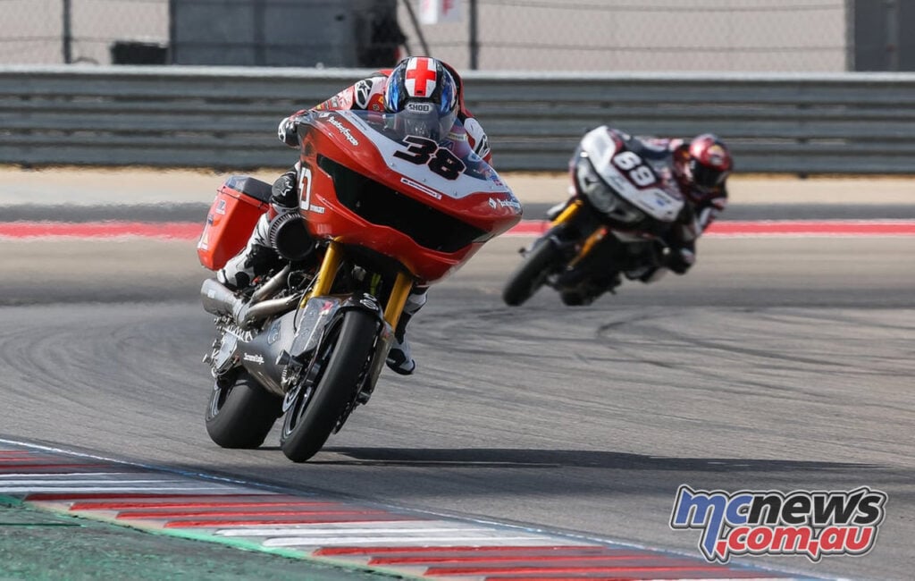 Bradley Smith lifts the front wheel of the number 38 Harley-Davidson ahead of Hayden Gillim’s number 69 Indian.