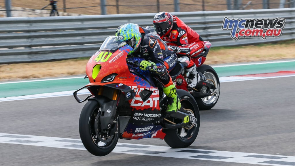 Sean Dylan Kelly on the number 40 BMW crosses the line ahead of Cameron Beaubier’s red Ducati at COTA.