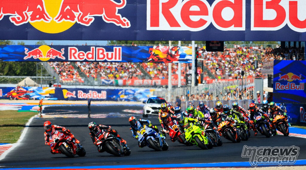 Marc Marquez and Marco Bezzecchi head the MotoGP field into the opening corner at Misano.
