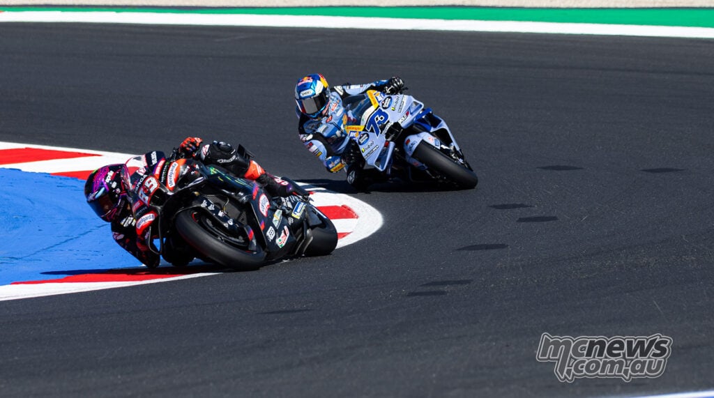 Jorge Martin rides his number 89 Aprilia through a corner ahead of Alex Marquez's number 73 Ducati.
