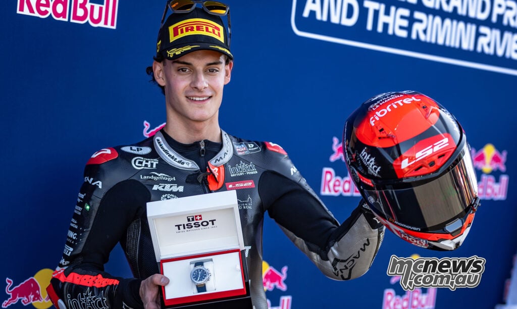 David Almansa holds his Tissot pole-position award and red helmet after Moto3 qualifying at Misano.