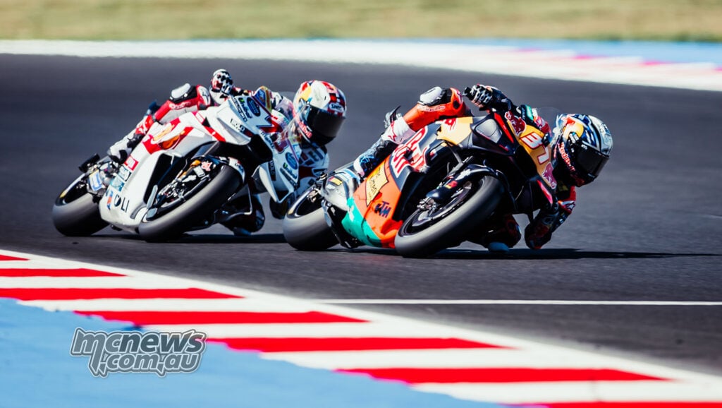 Pedro Acosta corners on his KTM with Alex Marquez close behind on the white Gresini Ducati.