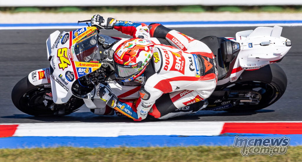 Elevated view of Fermin Aldeguer leaning his number 54 Gresini Ducati through a corner at Misano.