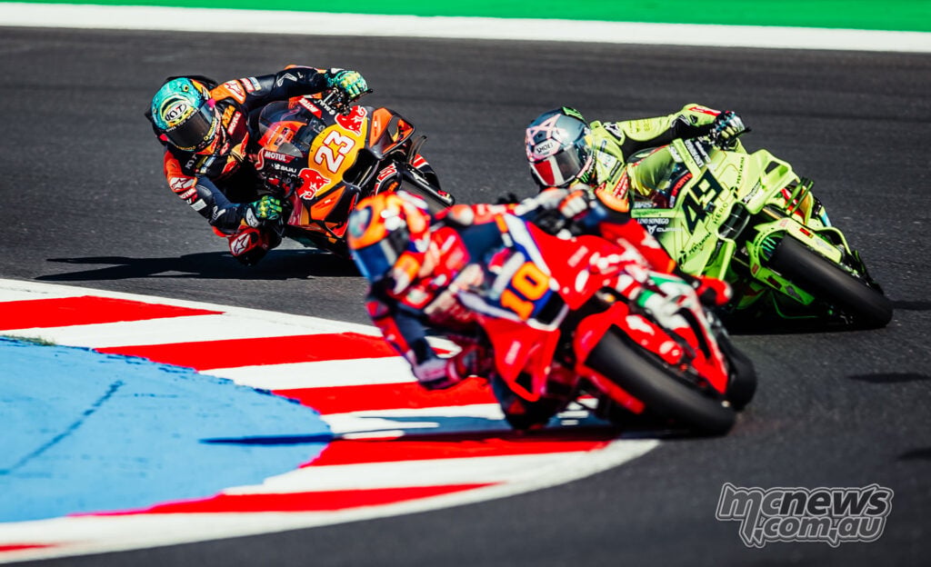 Luca Marini leads Fabio Di Giannantonio and Enea Bastianini through a corner at Misano.