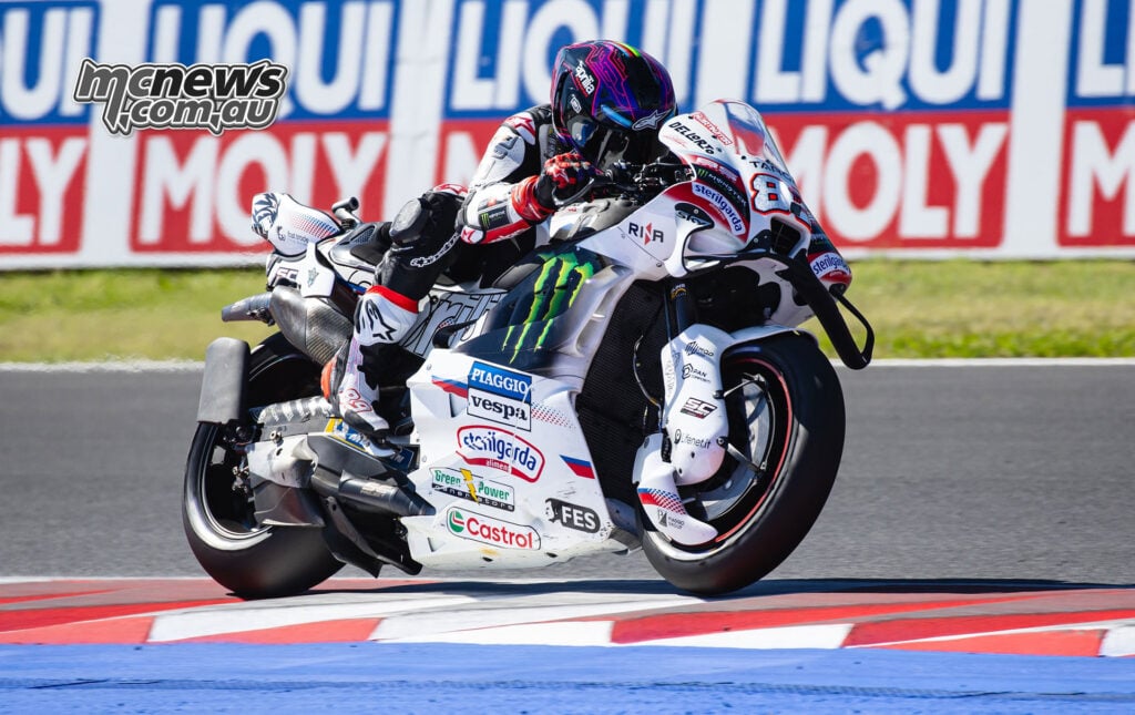 Jorge Martin rides his number 89 Aprilia over the painted kerbing at Misano.