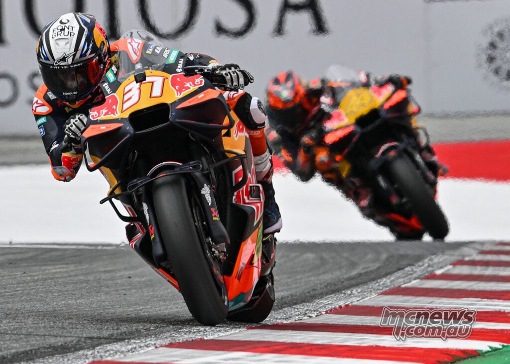 Pedro Acosta riding over the kerbing with fellow KTM rider Pol Espargaro following at the Red Bull Ring.
