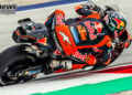 Rear three-quarter view of Pedro Acosta cornering on his Red Bull KTM beside the Red Bull Ring kerbing.