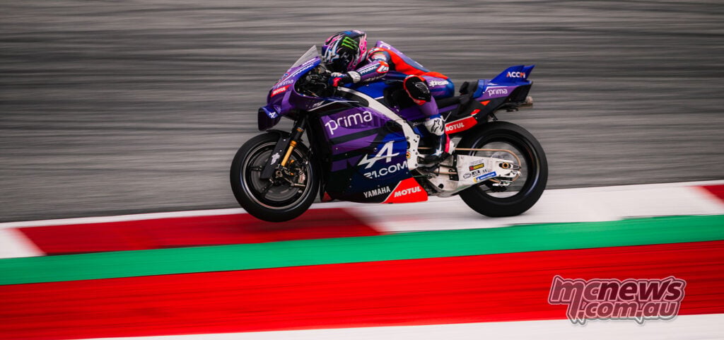 Panning shot of Jack Miller riding his purple number 43 Pramac Yamaha past the Red Bull Ring kerbing.
