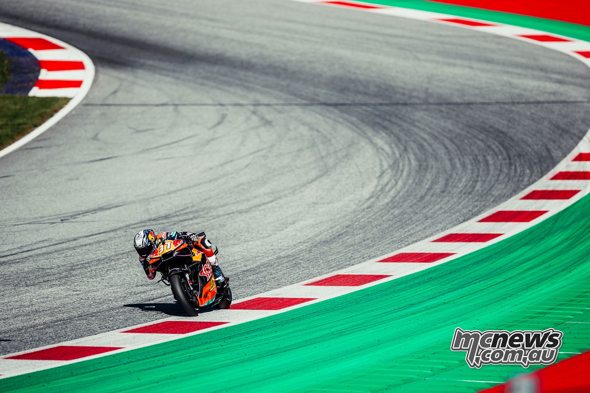 Pedro Acosta corners alone on his KTM with a large stretch of empty track behind him.