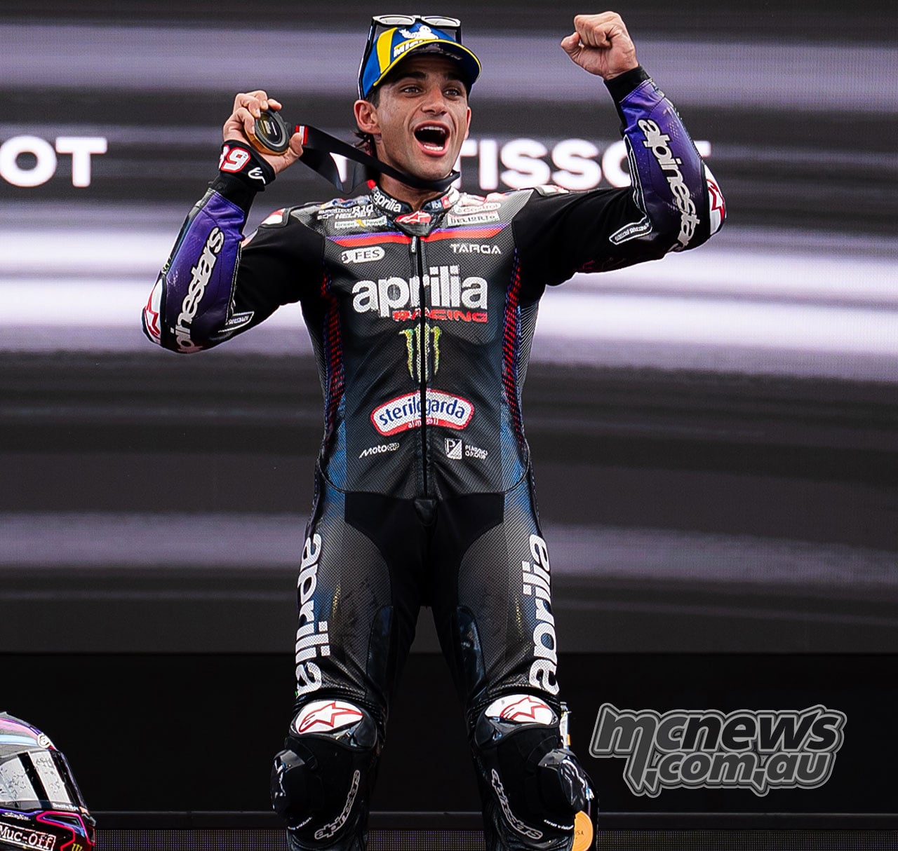 Jorge Martin jumps with both fists raised during the Austrian Sprint podium celebrations.