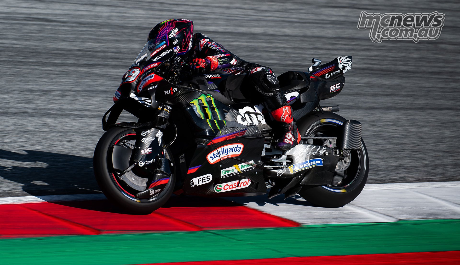 Jorge Martin leans his Aprilia through a corner beside the Red Bull Ring kerbing.