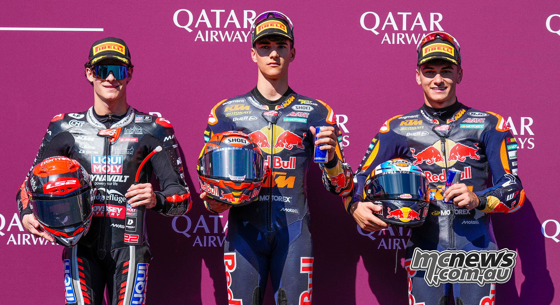David Almansa, Brian Uriarte and Alvaro Carpe pose with their helmets after Austrian Moto3 qualifying.