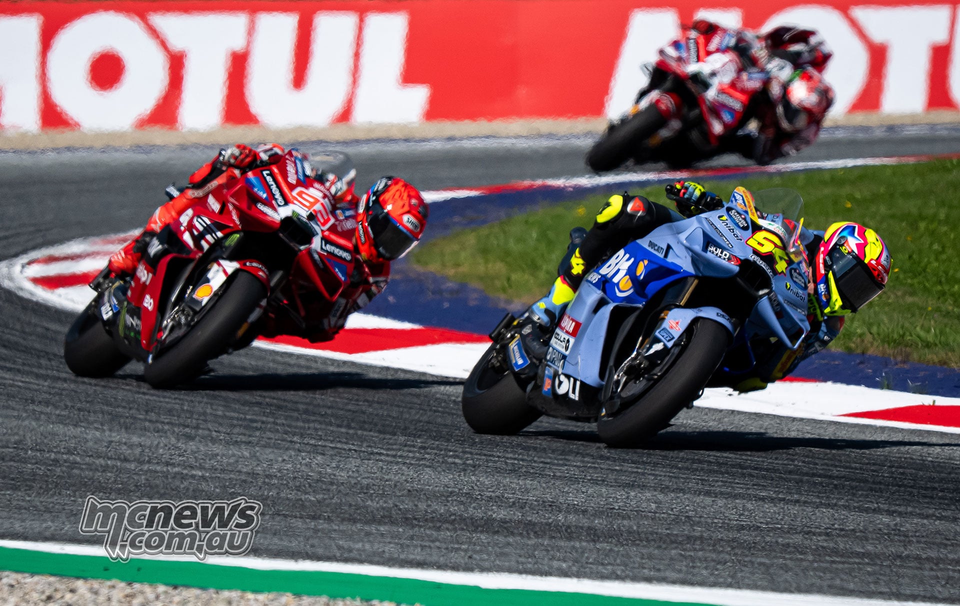 Fermin Aldeguer leads Marc Marquez and Francesco Bagnaia through a corner at the Red Bull Ring.