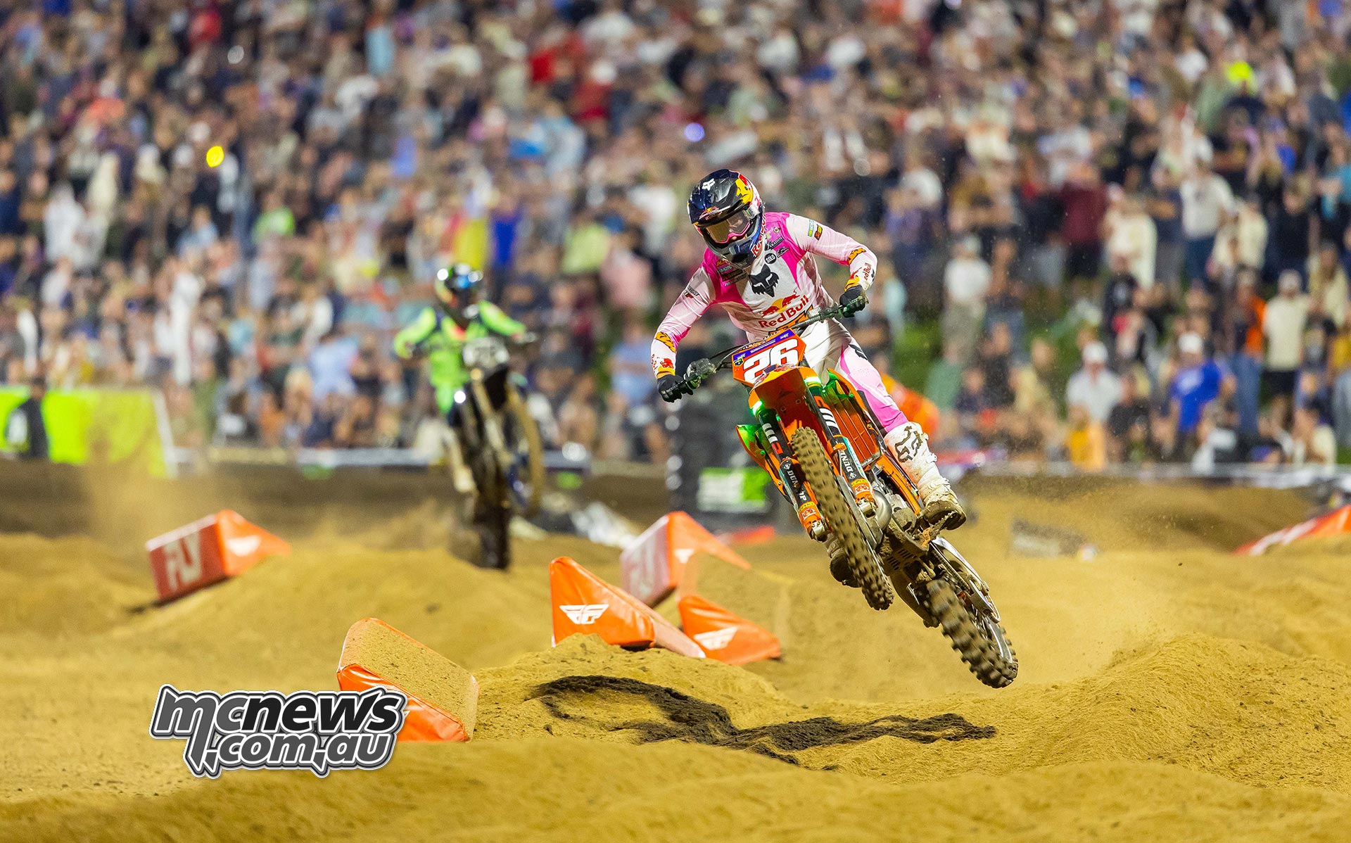 Jorge Prado leads Haiden Deegan and Hunter Lawrence over a sandy rise.