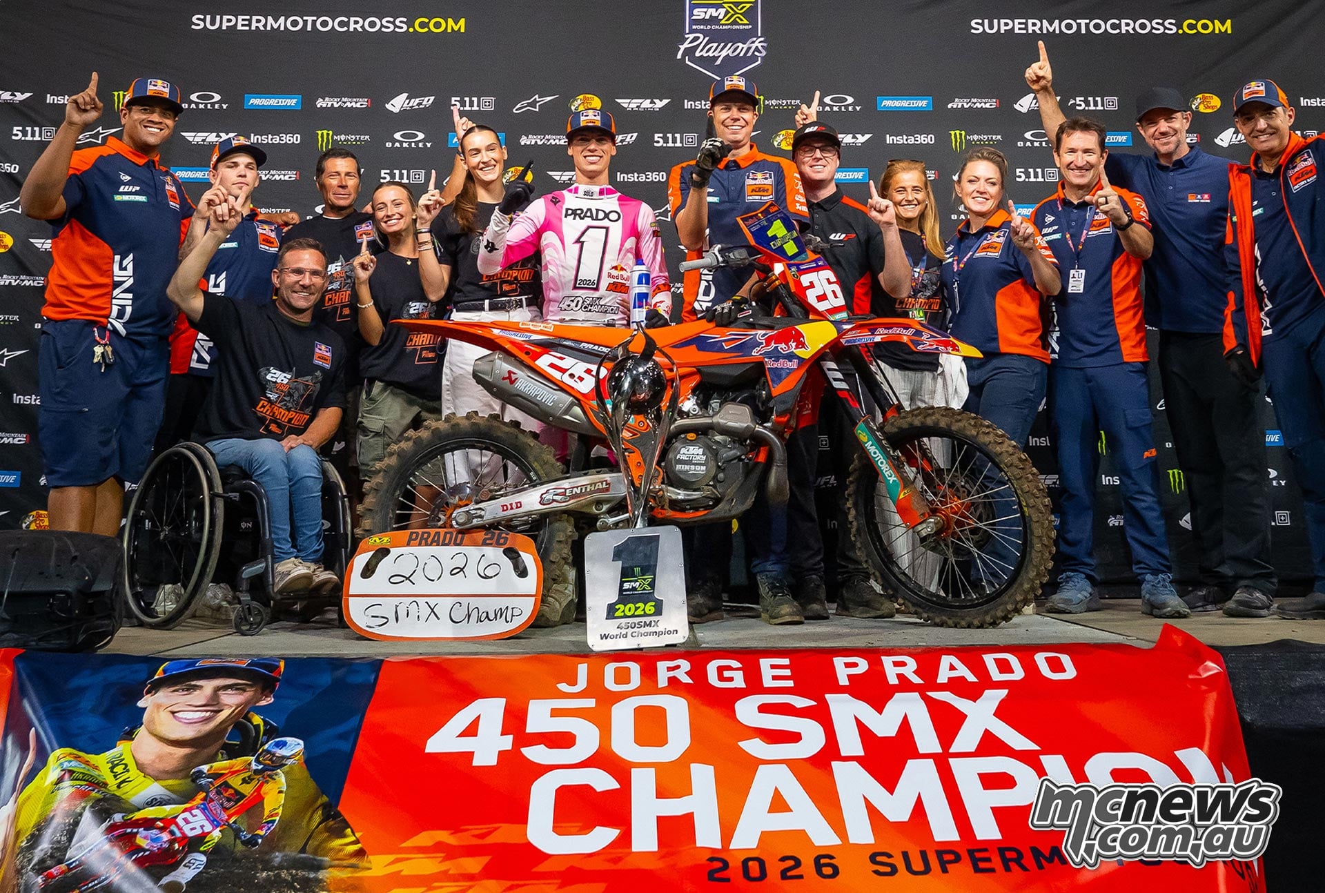 Jorge Prado and the KTM team pose with his motorcycle and 2026 champion banner.