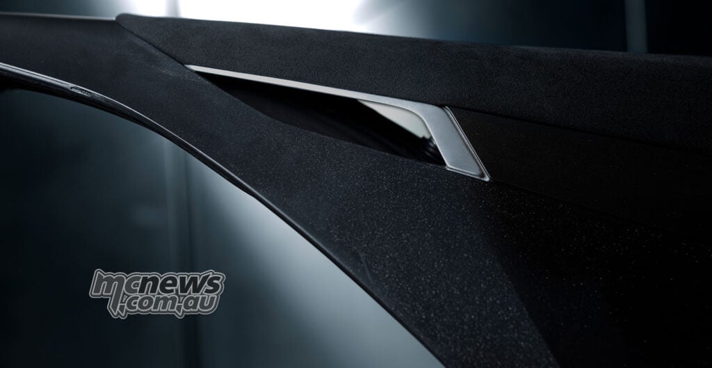 Close-up of the Stark VARG SM Sköll’s textured black seat, silver trim and black rear body panel.