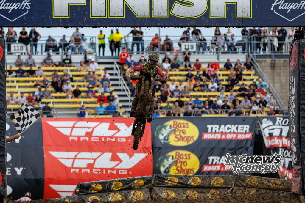 Cole Davies jumps beneath the finish gantry as the chequered flag waves for his 250SMX Race Two victory at Columbus.