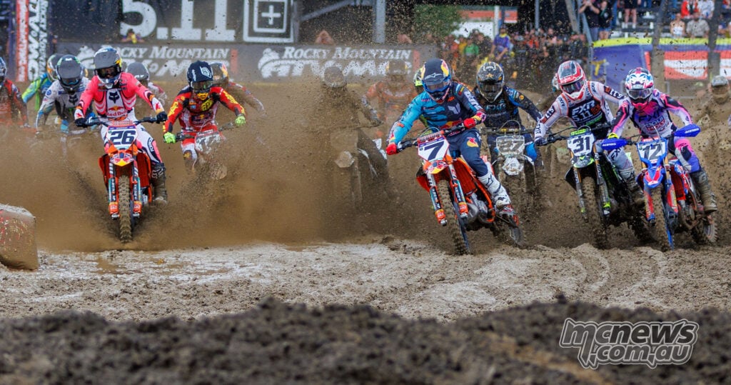 Jorge Prado, Aaron Plessinger and Shane McElrath charge through flying mud at the start of 450SMX Race One at Columbus.