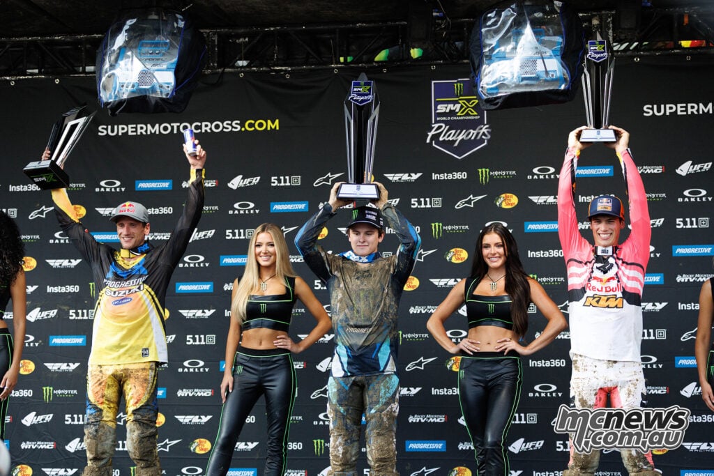 Ken Roczen, Haiden Deegan and Jorge Prado raise their trophies on the Columbus 450 overall podium.