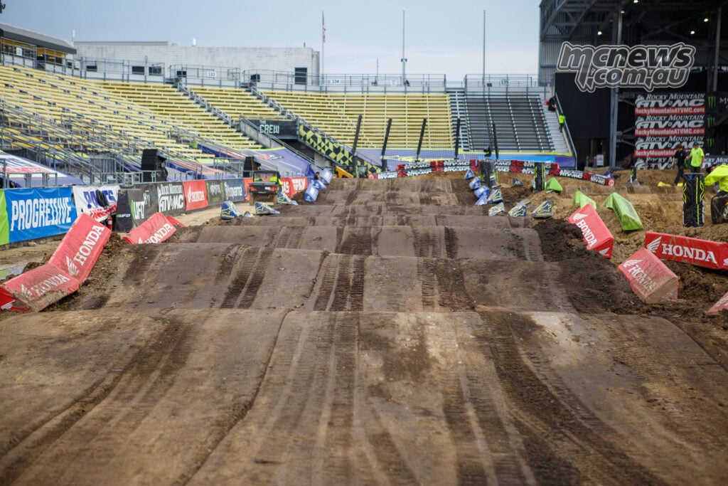 Freshly groomed jumps in the Columbus SMX rhythm section, with machinery tracks visible across the dirt.