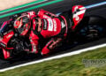 Nicolo Bulega leans the red number 11 Aruba.it Racing Ducati through a corner during Friday practice at Magny-Cours.