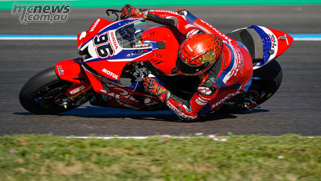 Jake Dixon at full lean on the red, white and blue number 96 Honda CBR1000RR-R Fireblade SP at Magny-Cours.
