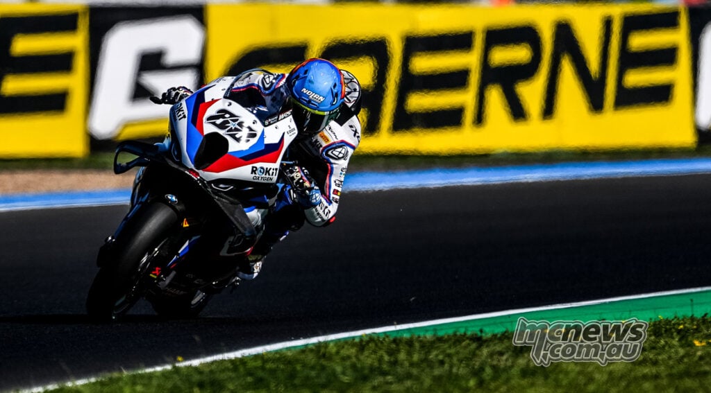 Miguel Oliveira rides the white, blue and red number 88 BMW M 1000 RR at Magny-Cours.