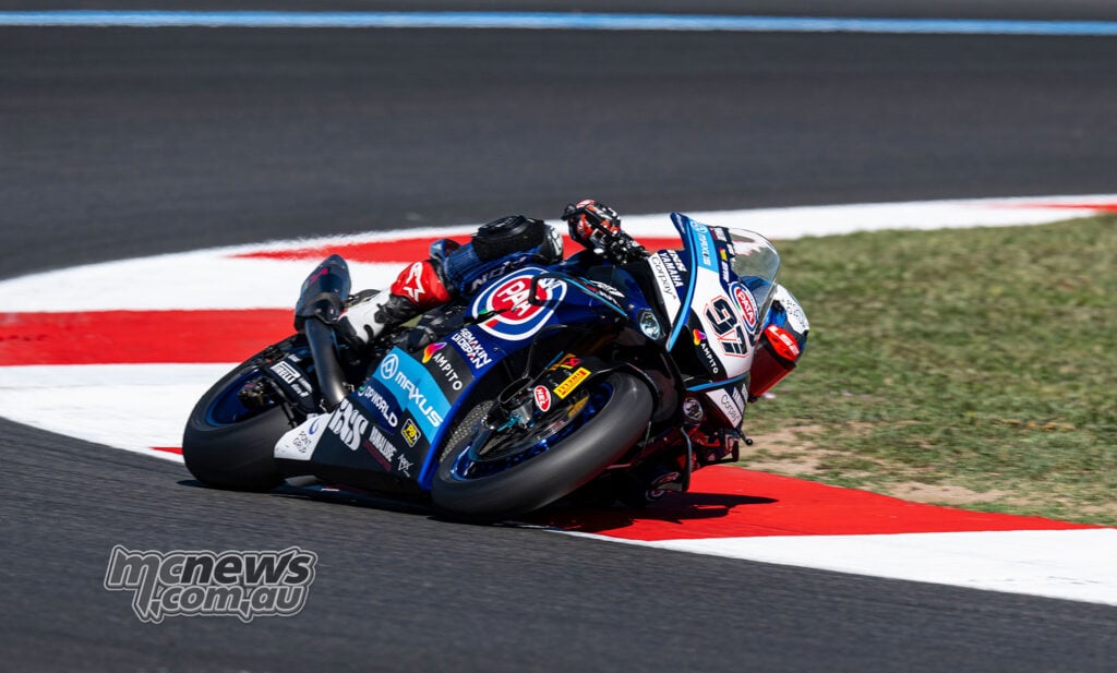 Xavi Vierge rides the blue number 97 Pata Maxus Yamaha over a red-and-white kerb at Magny-Cours.
