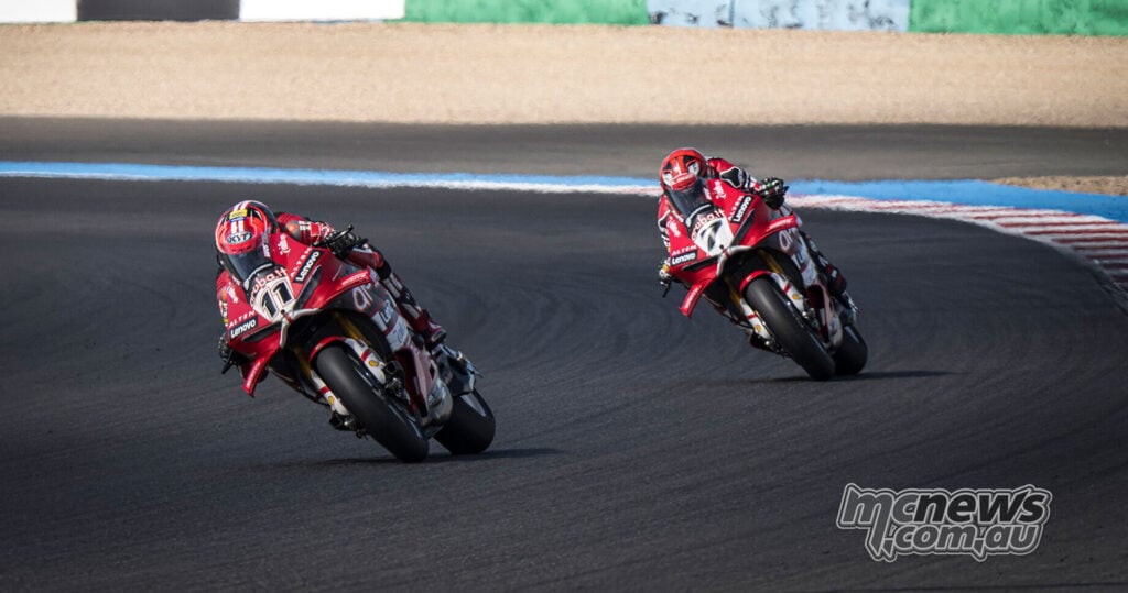 Nicolo Bulega on the red number 11 Ducati leads Iker Lecuona on the number 7 Ducati through a sweeping corner.