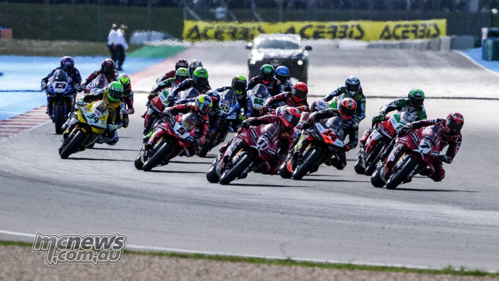 Nicolo Bulega heads the tightly grouped WorldSBK field through an opening corner at Magny-Cours.
