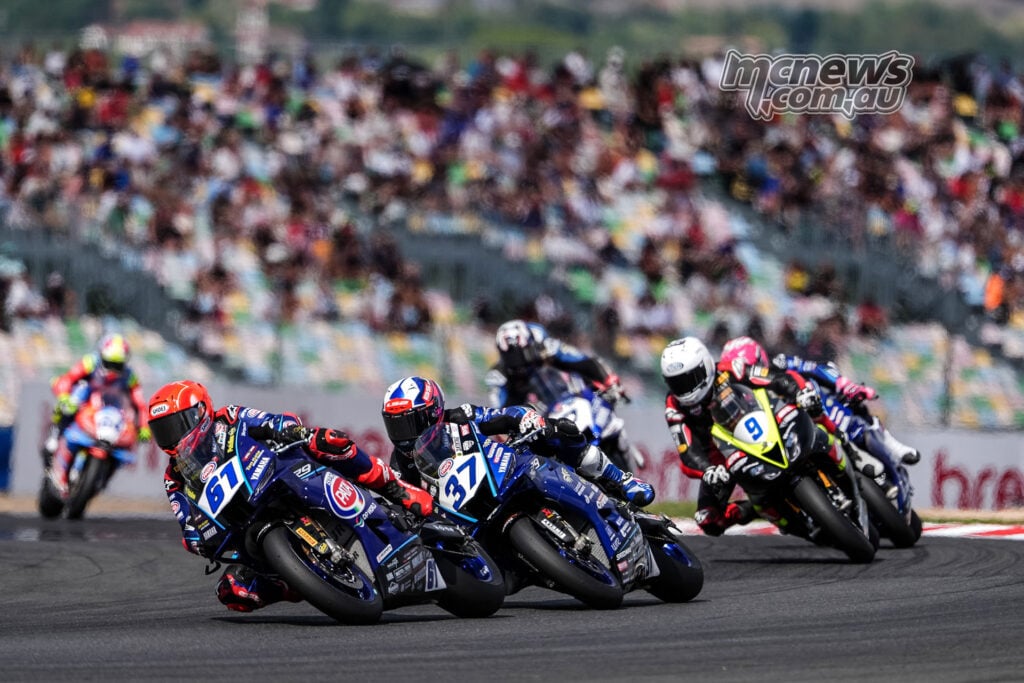 Can Oncu on the number 61 Yamaha races beside Roberto Garcia on the number 37 Yamaha, with Jorge Navarro close behind.