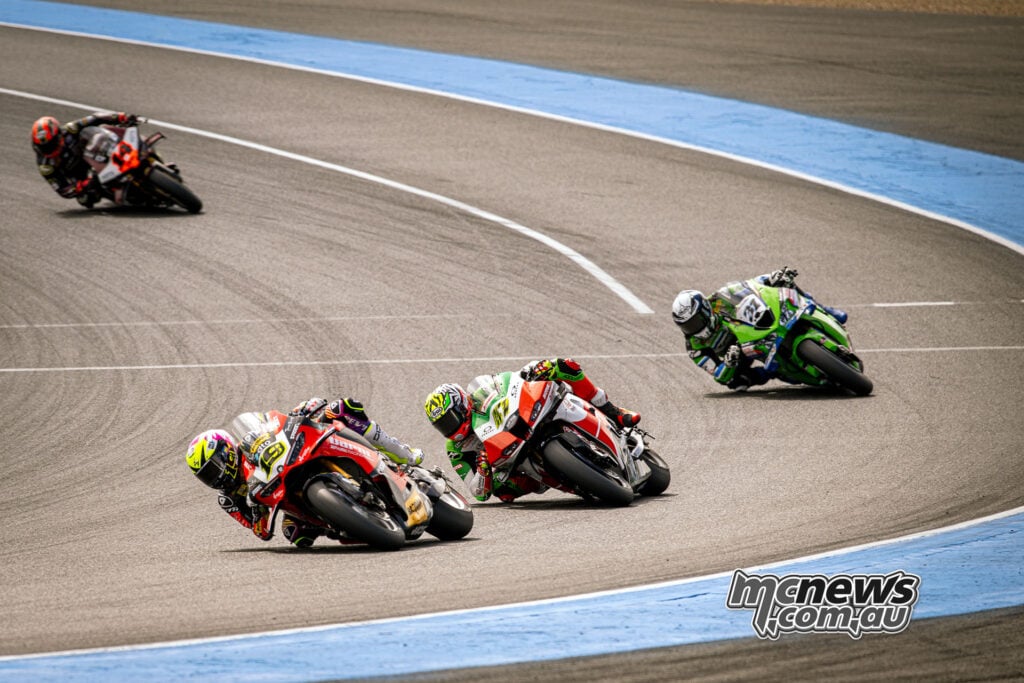 Alvaro Bautista leads Axel Bassani and Garrett Gerloff closely through a Magny-Cours corner.