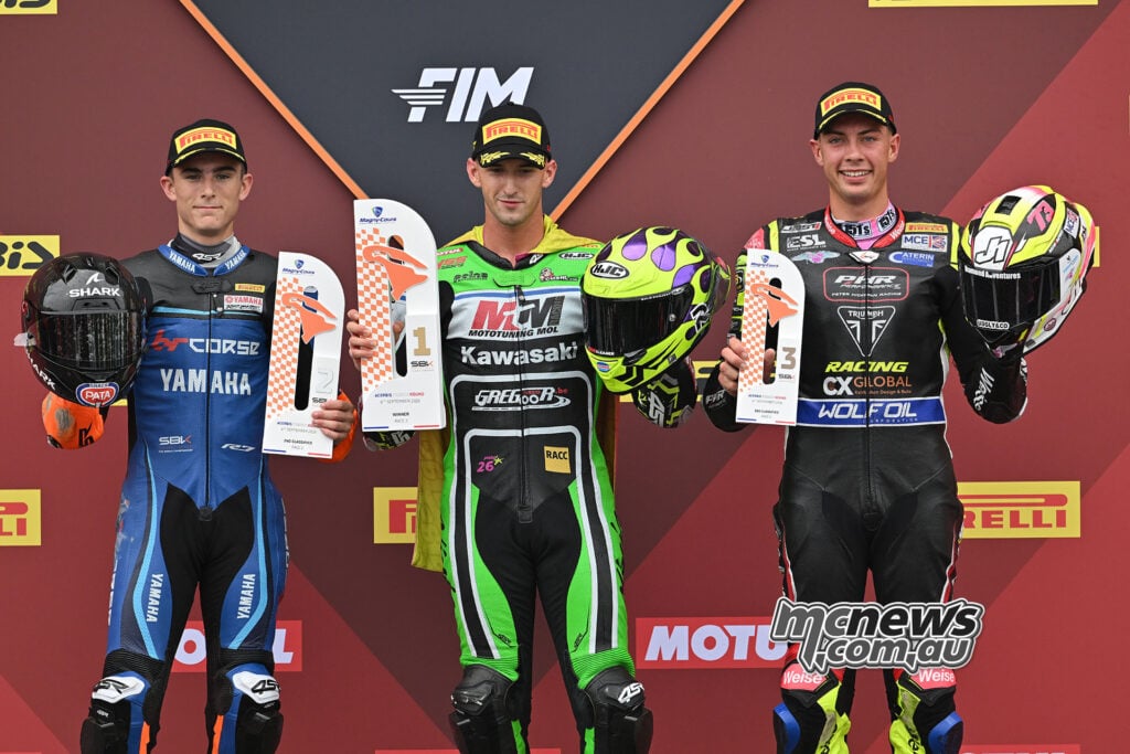 From left, Carter Thompson, Xavi Artigas and Fenton Seabright hold their WorldSPB Race 2 trophies.