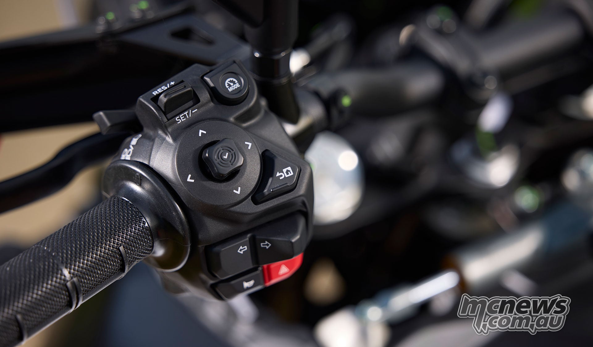World Raid left handlebar switchgear showing cruise-control buttons, menu joystick, indicators and hazard switch.