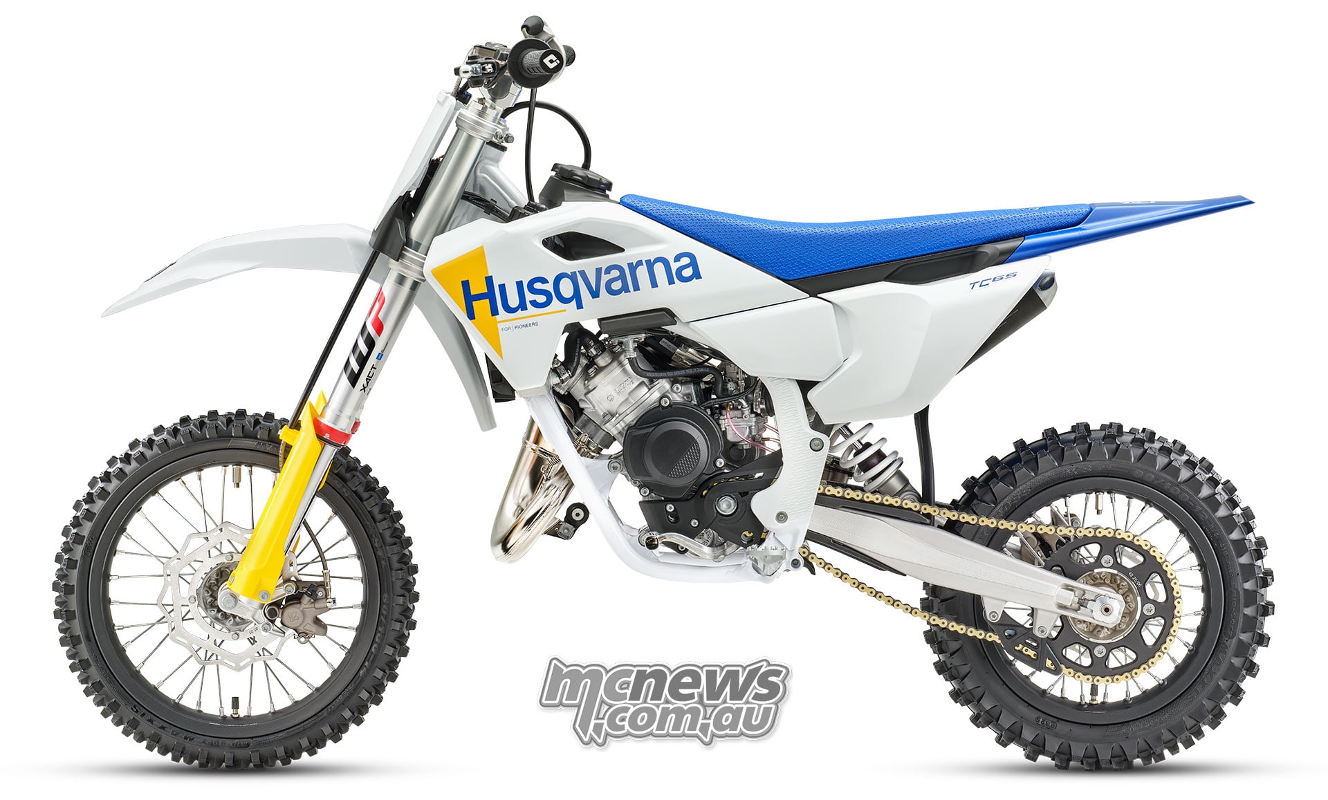 Left-side studio view of the 2027 Husqvarna TC 65 with white bodywork, a blue seat and revised blue and yellow graphics.