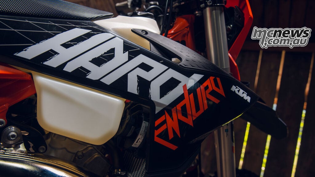 Close-up of the 2027 KTM 300 EXC HARDENDURO black, white and orange radiator-shroud graphics.