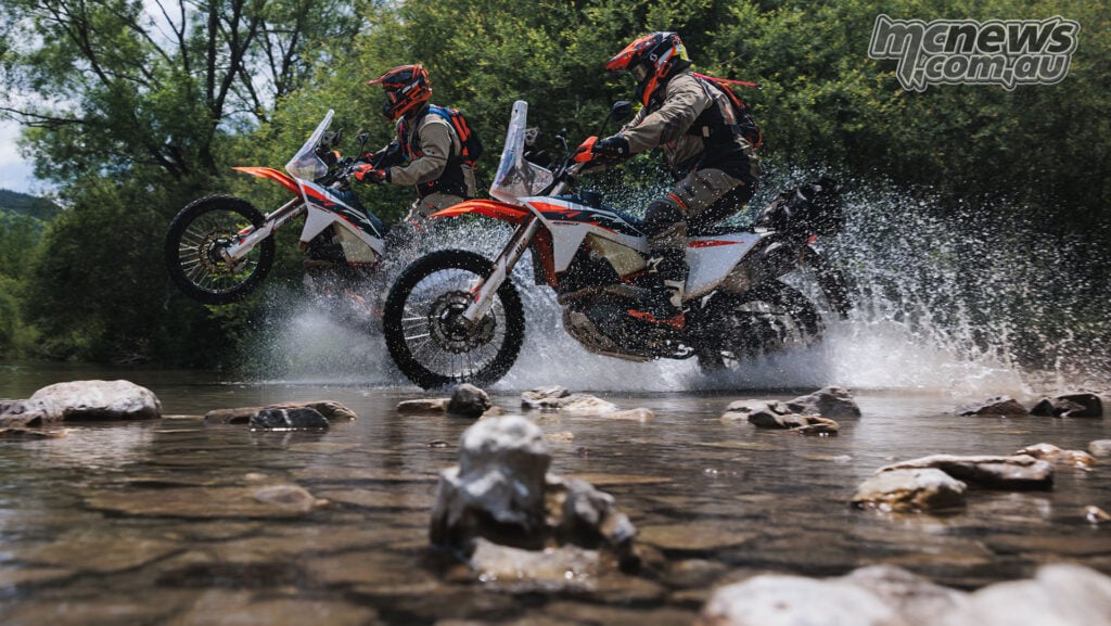 2027 KTM 690 Rally cornering on a rocky off-road trail