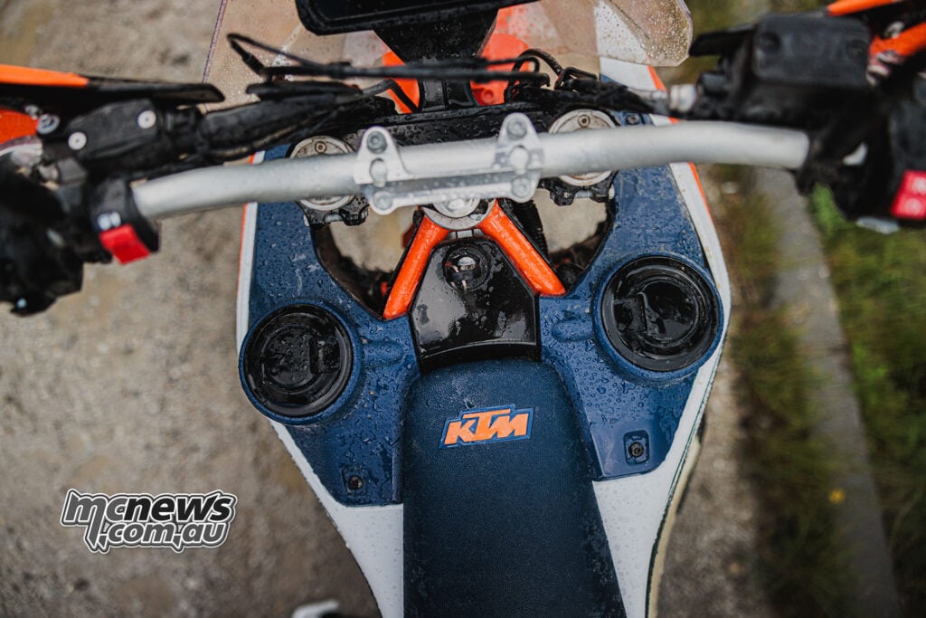 2027 KTM 690 Rally viewed from above showing the separate front fuel tank filler caps