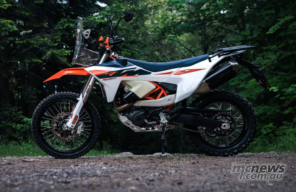 2027 KTM 690 Rally side view showing WP XPLOR suspension and 21-inch and 18-inch spoked wheels