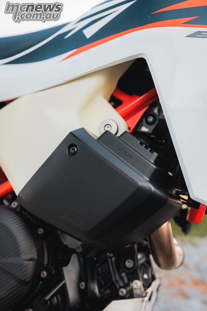 2027 KTM 690 Rally integrated tool storage compartment behind the side fairing