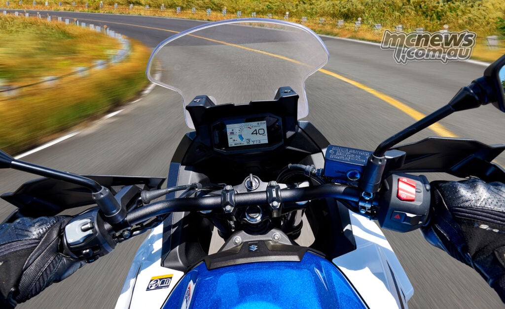 Rider’s view of the Suzuki SV-7GX handlebars, windscreen and 4.2-inch colour TFT display while riding