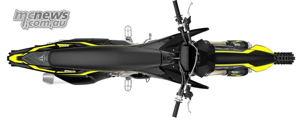Overhead view of the 2027 Triumph TF 250-X showing the narrow seat, fuel cap, handlebars and yellow graphics on the mudguards.