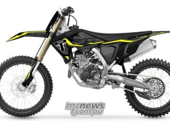 Left-side profile of the 2027 Triumph TF 250-X showing its drive chain, rear sprocket, aluminium frame and black bodywork.
