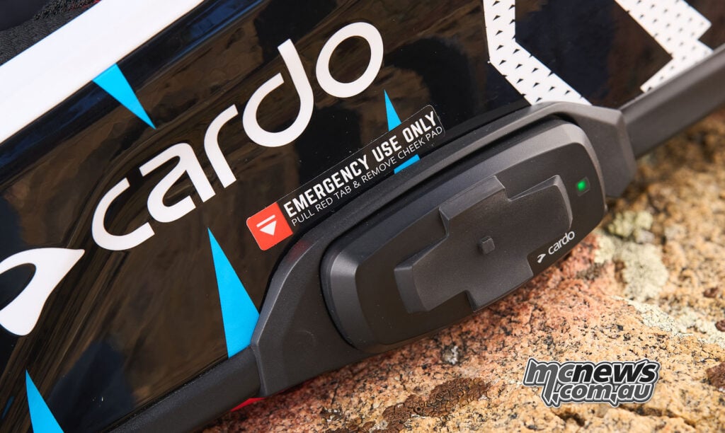 The Venture’s low-profile side controller is integrated into the helmet, with the emergency cheek-pad release instruction marked immediately above it.