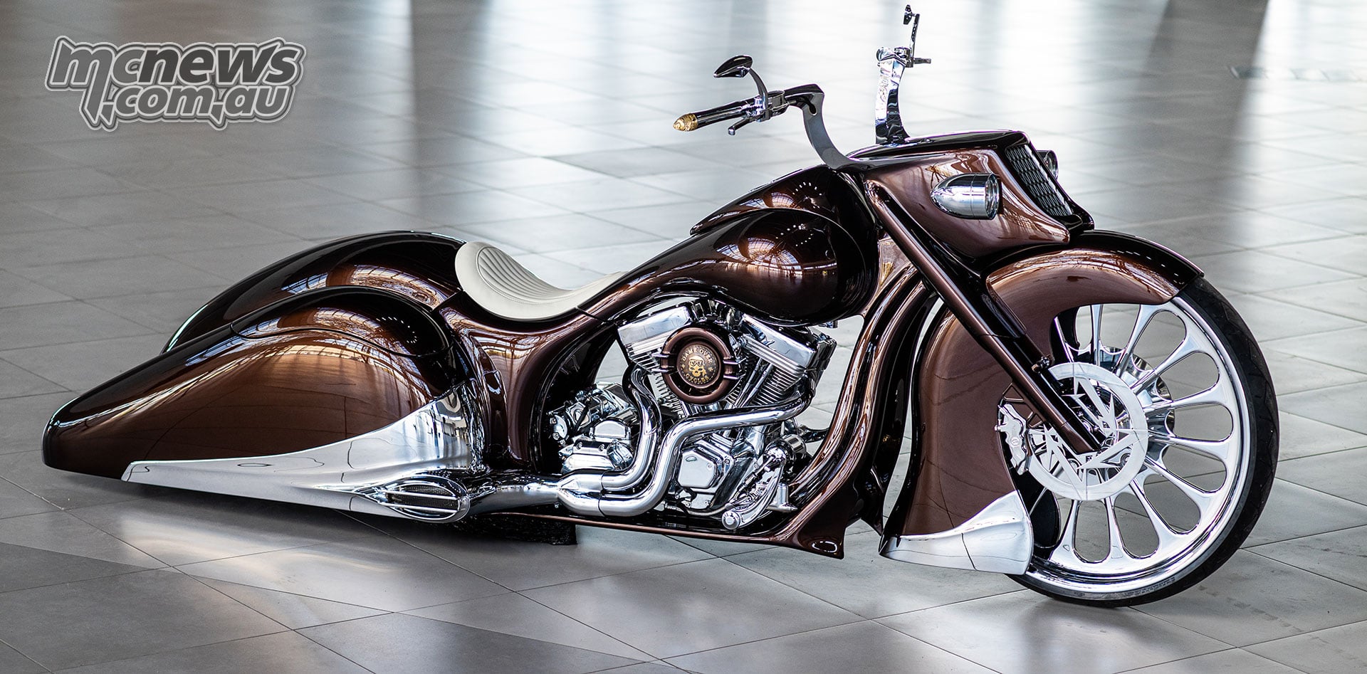 Game Over Cycles Slow Burn custom motorcycle with bronze bodywork, chrome V-twin engine and a 30-inch front wheel