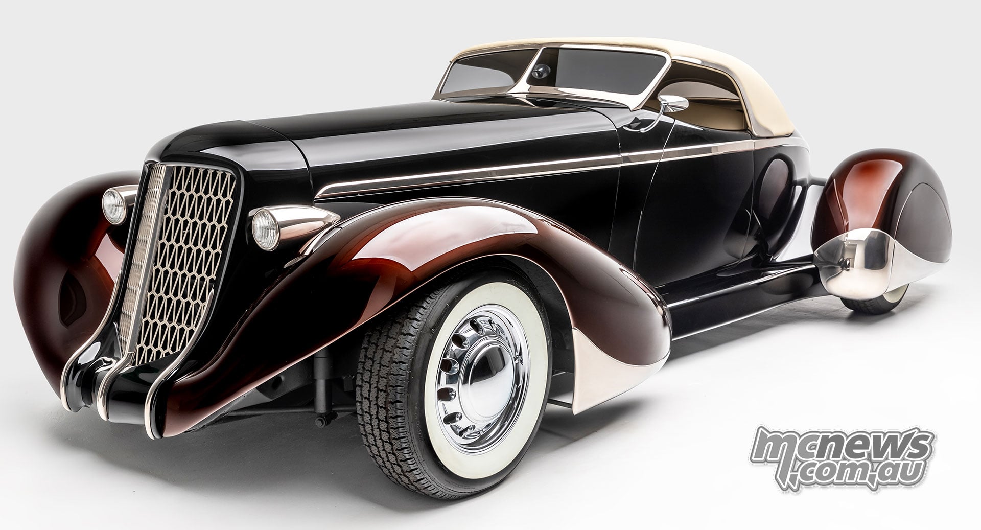 James Hetfield’s Slow Burn Auburn 852 Boattail Speedster with sweeping bronze guards, dark bodywork and a cream roof