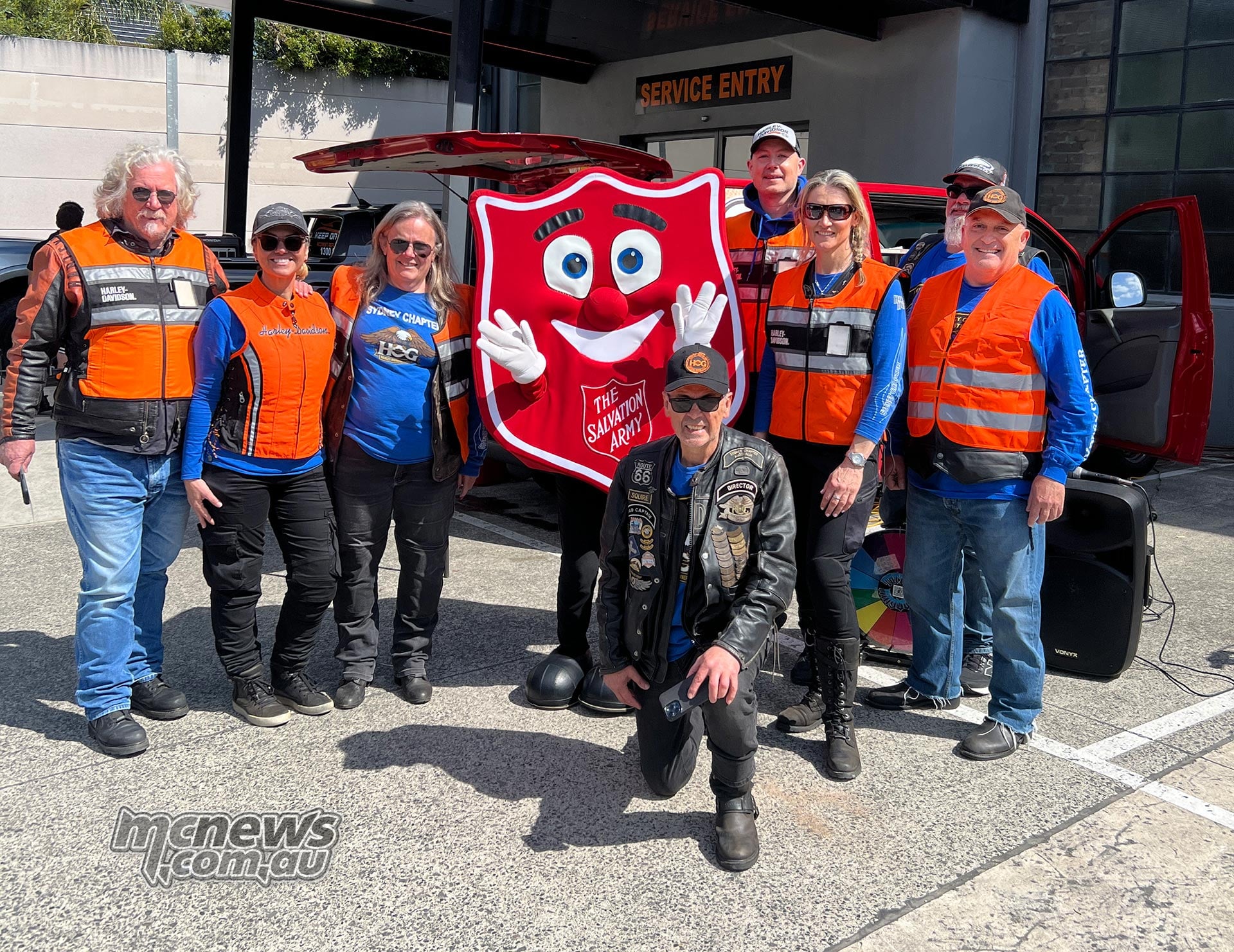 H.O.G. members and supporters with The Salvation Army mascot during the 2026 Harley-Davidson United We Ride charity event