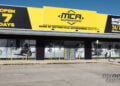 Yellow and black MCA Superstore signage above the Canberra store entrance in Fyshwick.
