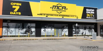 Yellow and black MCA Superstore signage above the Canberra store entrance in Fyshwick.